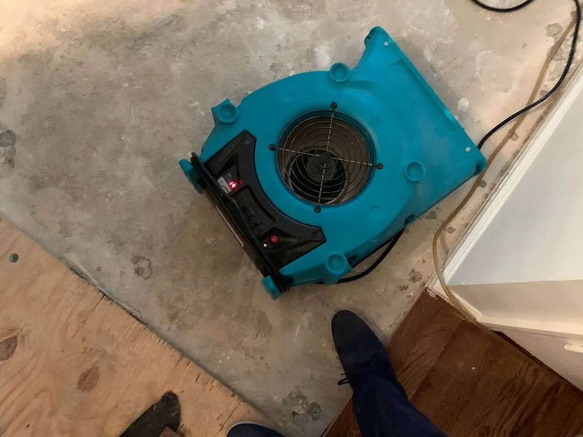 Air mover drying subfloor during Leak Detection & Repair in Appleton